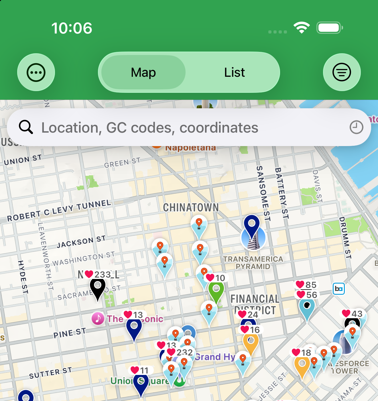 The Live tab's Map/List toggle and search field above the map, with cache pins and favorite-count badges.