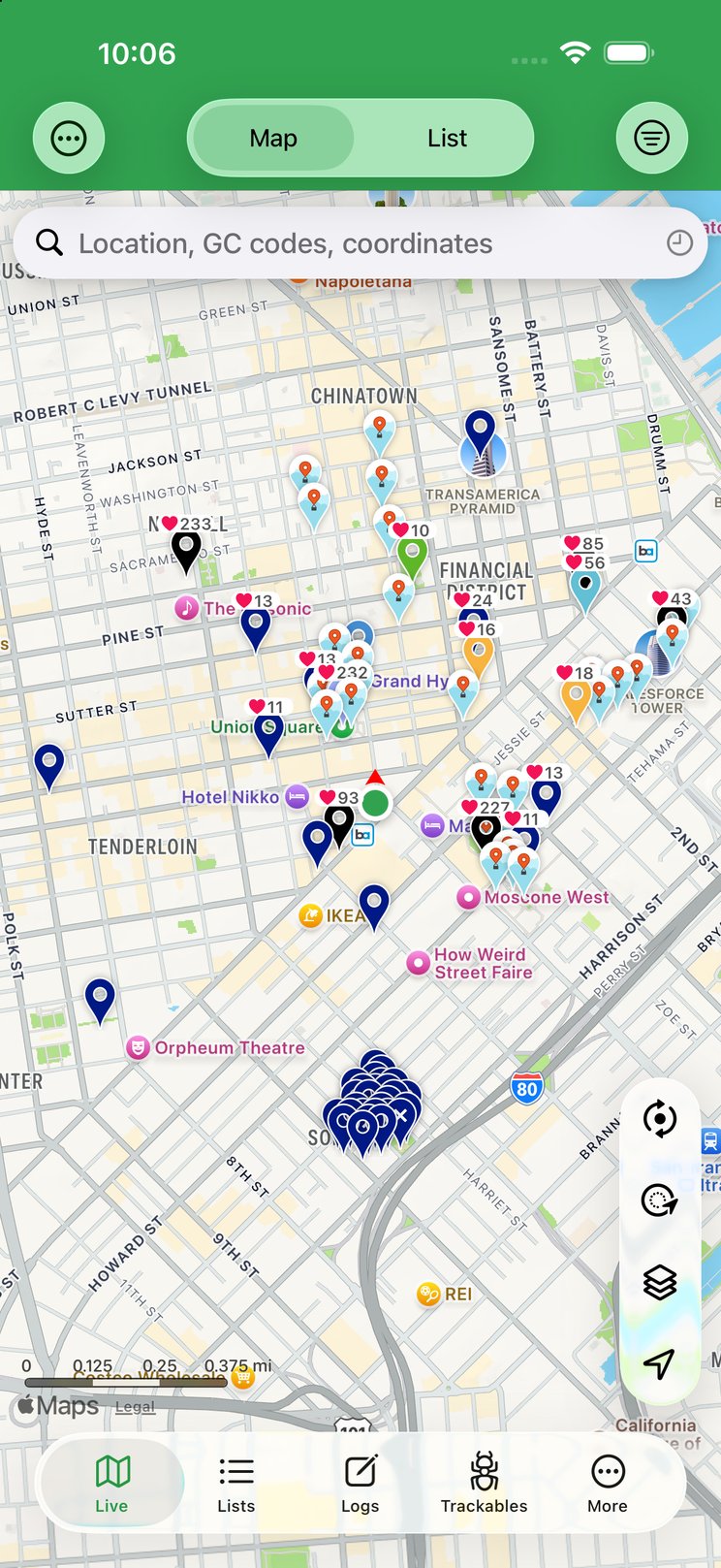 The Live tab: a map of nearby caches with the Map/List toggle, search field and map tools, above the Live, Lists, Logs, Trackables and More tab bar.