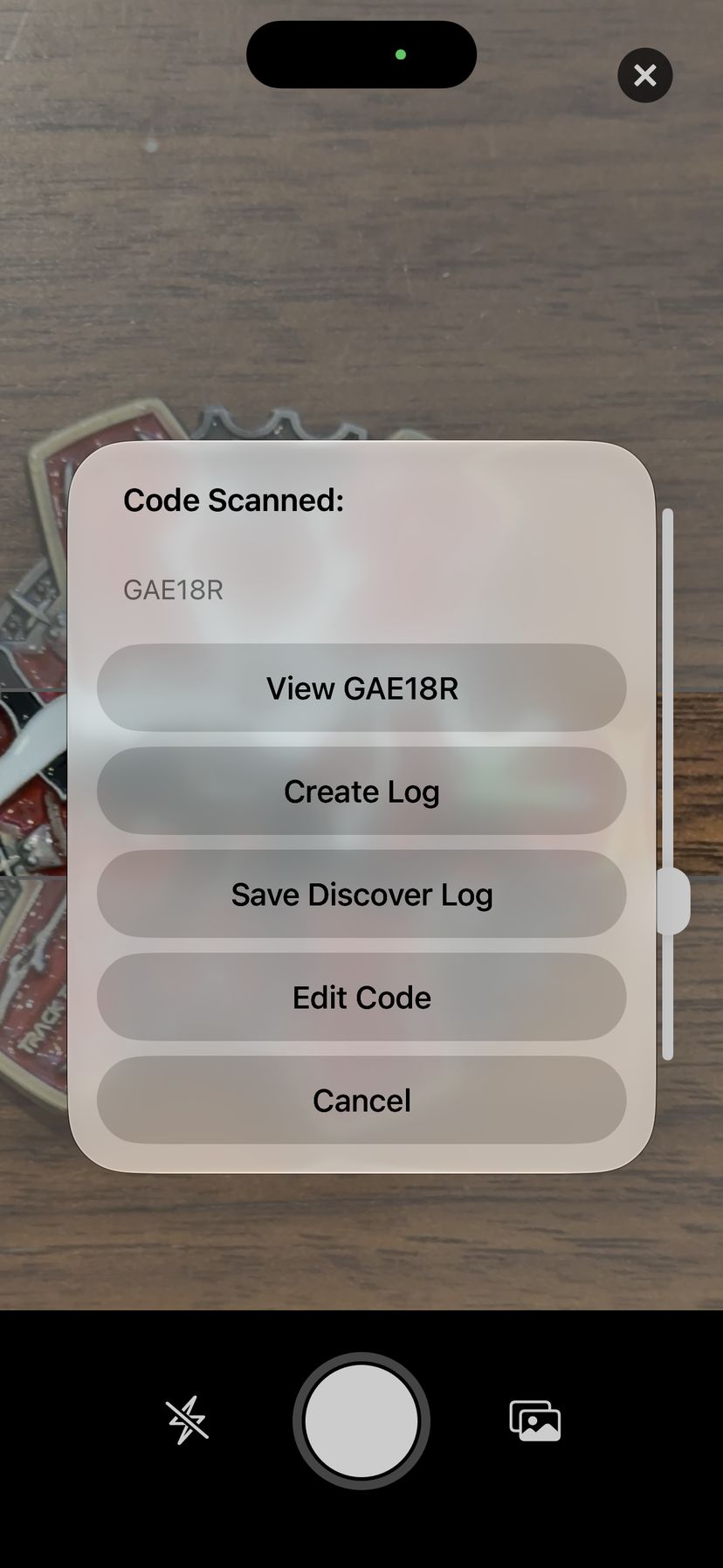 The Code Scanned sheet showing GAE18R with buttons to View, Create Log, Save Discover Log, Edit Code and Cancel.